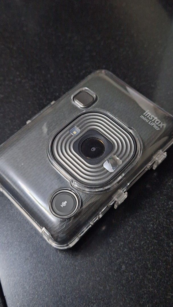 Instax Mini Liplay Hybrid (Category: Cameras) located in Bulacan. Submitted by samvastatin (Listing ID 1416634246, Image 1). Description: - Instax Mini Link smartphone printer. - Prints photos directly from your phone. - Sleek design and user-friendly interface. - Comes with a clear protective case. - Features power and print buttons. - Displays photos on the screen..