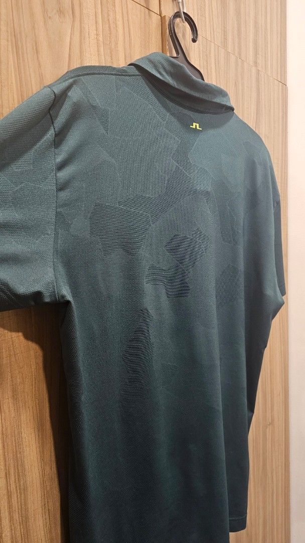 J. Lindeberg Golf Polo Shirt (Category: Tshirts & Polo Shirts ) located in Paranaque City. Submitted by misternpa (Listing ID 1416562552, Image 3). Description: - J.Lindeberg golf polo shirt - Dark green color - Classic polo collar - Three-button placket - J.Lindeberg logo on chest - Made from polyester and elastane blend - Regular fit - Used 2x only - RFS: I prefer an XL size in JL .