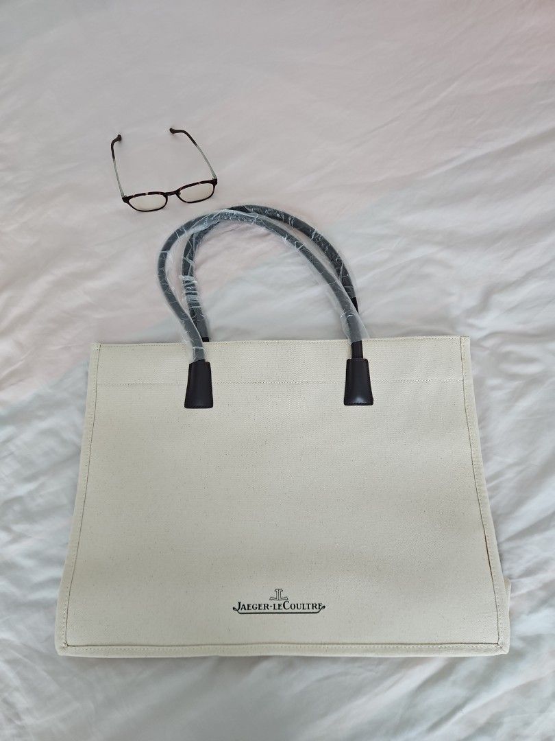 Jaeger Le Coultre bag (Category: Tote Bags) located in Singapore. Submitted by bonkadoodle (Listing ID 1416492421, Image 1). Description: Brand new Jaeger Le Coultre tote bag. Made of structured natural ecru canvas, with dark brown straps. Never used before and comes complete with dust bag (also in perfect condition)..