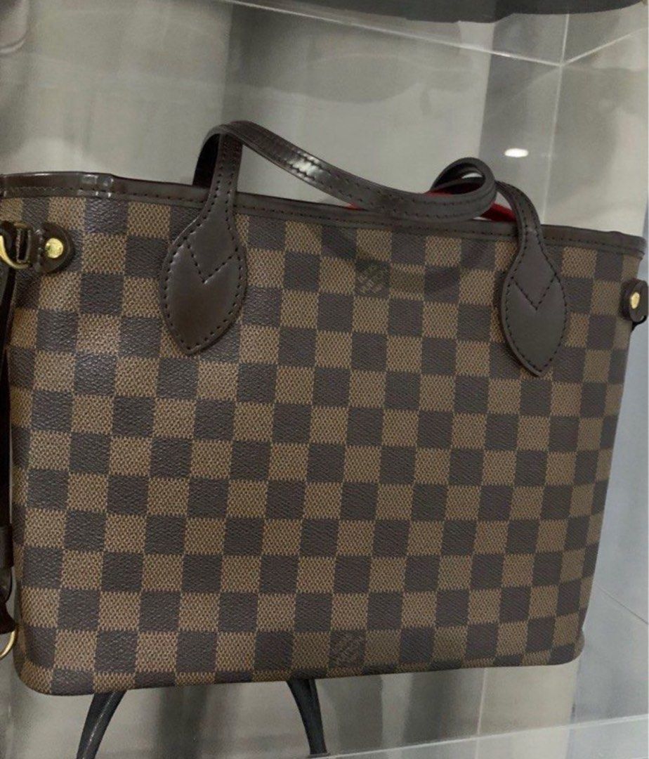 Louis Vuitton Damier Ebene Neverfull PM (Category: Luxury Bags & Wallets) located in Manila. Submitted by decluterthings888 (Listing ID 1416620890, Image 1). Description: - Authentic Louis Vuitton Neverfull pm - Damier Ebene canvas - Brown leather handles and trim - Gold-tone hardware - Spacious interior - Adjustable side laces - Stylish everyday tote.