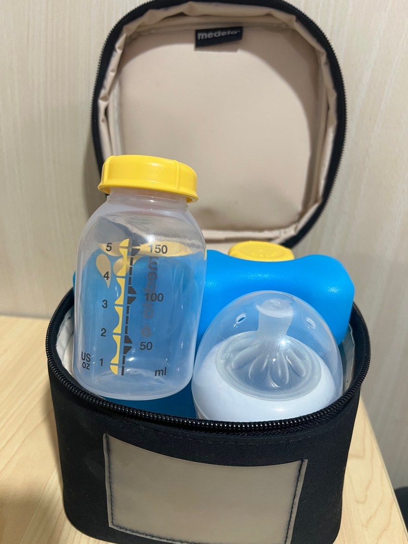 Medela cooler with bottles (Category: Breastfeeding & Bottle Feeding) located in Quezon City. Submitted by ex-box (Listing ID 1416591934, Image 3). Description: Medela Cooler with cooling element + 3pcs 150ml/5oz milk bottle -can fit 125ml / 4oz Philips Avent bottle (not included, for reference only) Used for only 3months ₱1500 TAKE ALL.