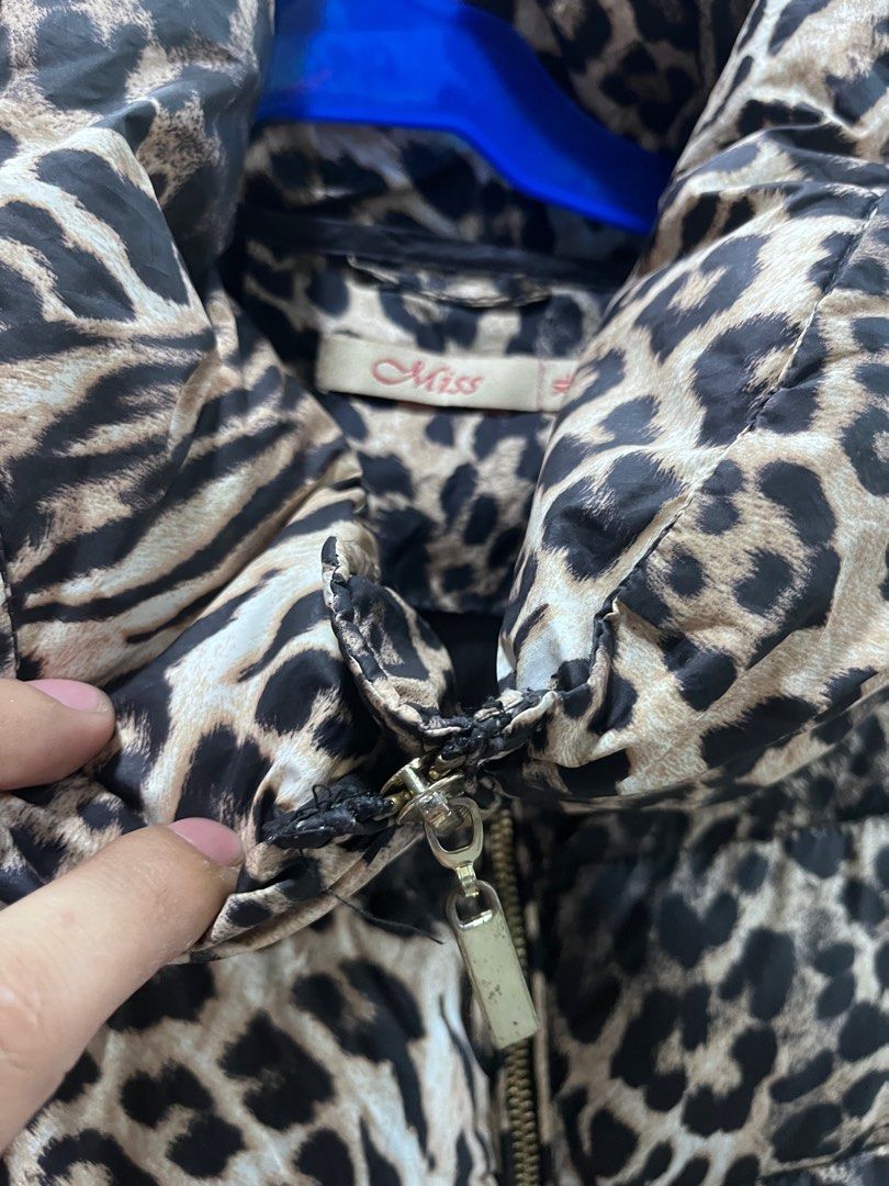 Miss Leopard Print Puffer Jacket XL (Category: Coats, Jackets and Outerwear) located in Baguio. Submitted by lattethrift21 (Listing ID 1416535137, Image 2). Description: - Stylish leopard print puffer jacket - Size: XL Dimes 24 x 17 - Features a high collar and full-length zipper - Lining: Black - Material: 100% polyester - Condition: excellent.