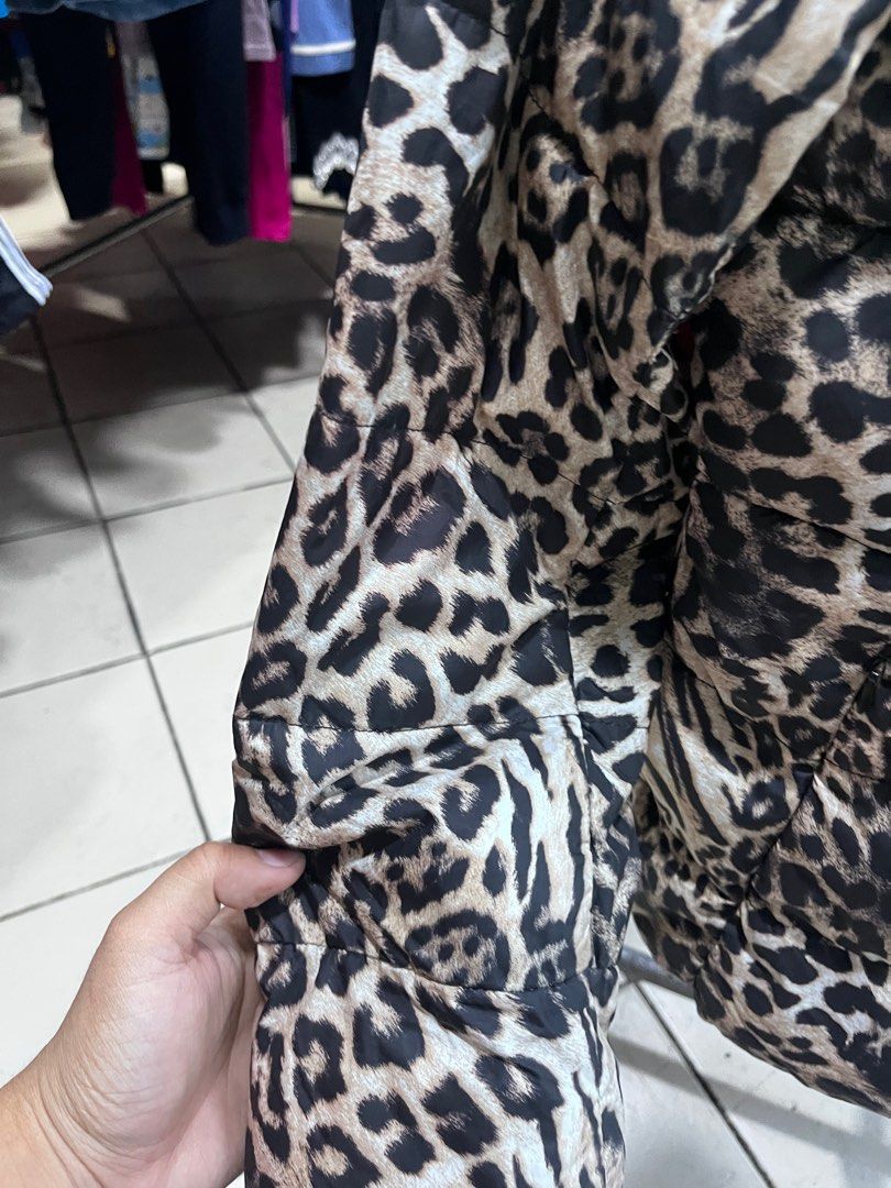 Miss Leopard Print Puffer Jacket XL (Category: Coats, Jackets and Outerwear) located in Baguio. Submitted by lattethrift21 (Listing ID 1416535137, Image 3). Description: - Stylish leopard print puffer jacket - Size: XL Dimes 24 x 17 - Features a high collar and full-length zipper - Lining: Black - Material: 100% polyester - Condition: excellent.