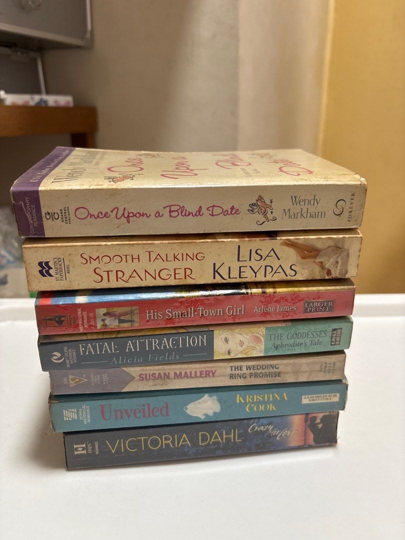 MOVING OUT SALE: Romance Novels (Category: Storybooks) located in Manila. Submitted by matchagurl_ (Listing ID 1416486174, Image 1). Description: BOOKS FOR SALE These books are old so please manage your expectation. Natural age marks (foxing) on pages. RFS: moving out - Romance novel collection - Authors include Wendy Markham, Lisa Kleypas, Arlene James, Alicia Fields, Susan Mallery, Kristina Cook, and Victoria Dahl - Titles include: "Once Upon a