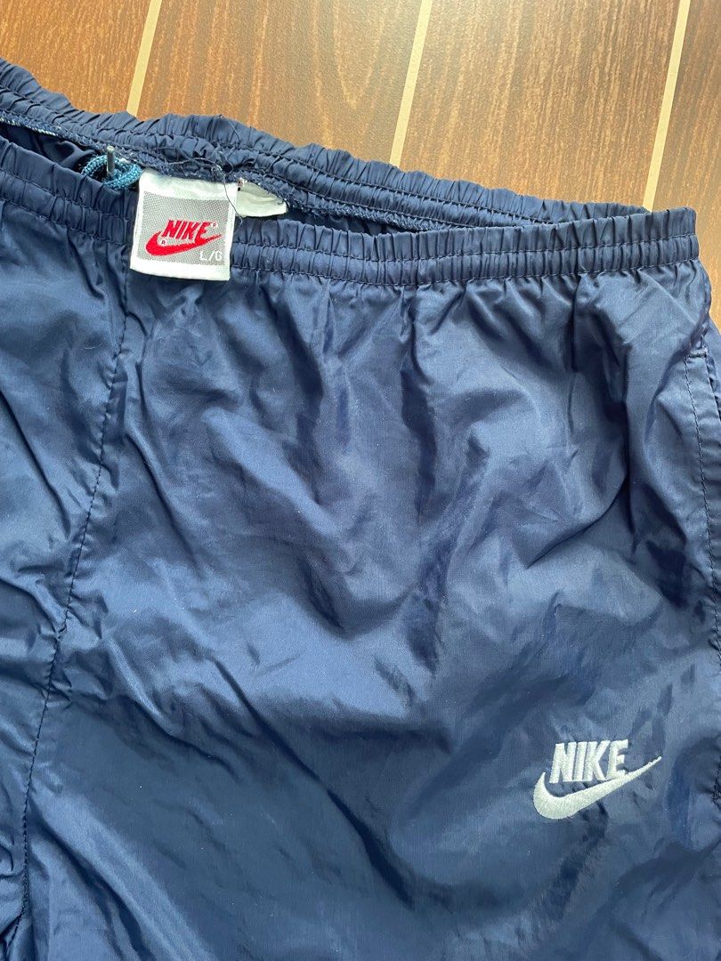 Nike Track Pants (Category: Joggers) located in Bulacan. Submitted by mak.vtg (Listing ID 1416542802, Image 2). Description: Nike Track pants Waist: Length: Leg open Zippers working Dot stain Still in good condition.