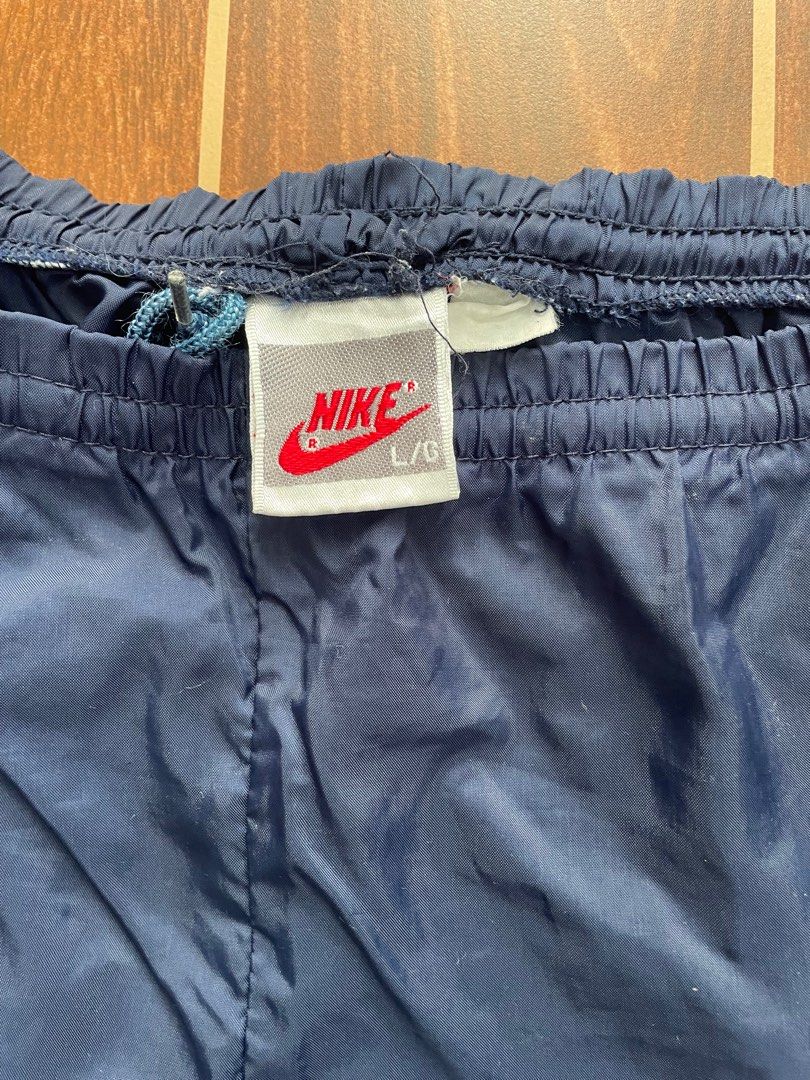 Nike Track Pants (Category: Joggers) located in Bulacan. Submitted by mak.vtg (Listing ID 1416542802, Image 3). Description: Nike Track pants Waist: Length: Leg open Zippers working Dot stain Still in good condition.