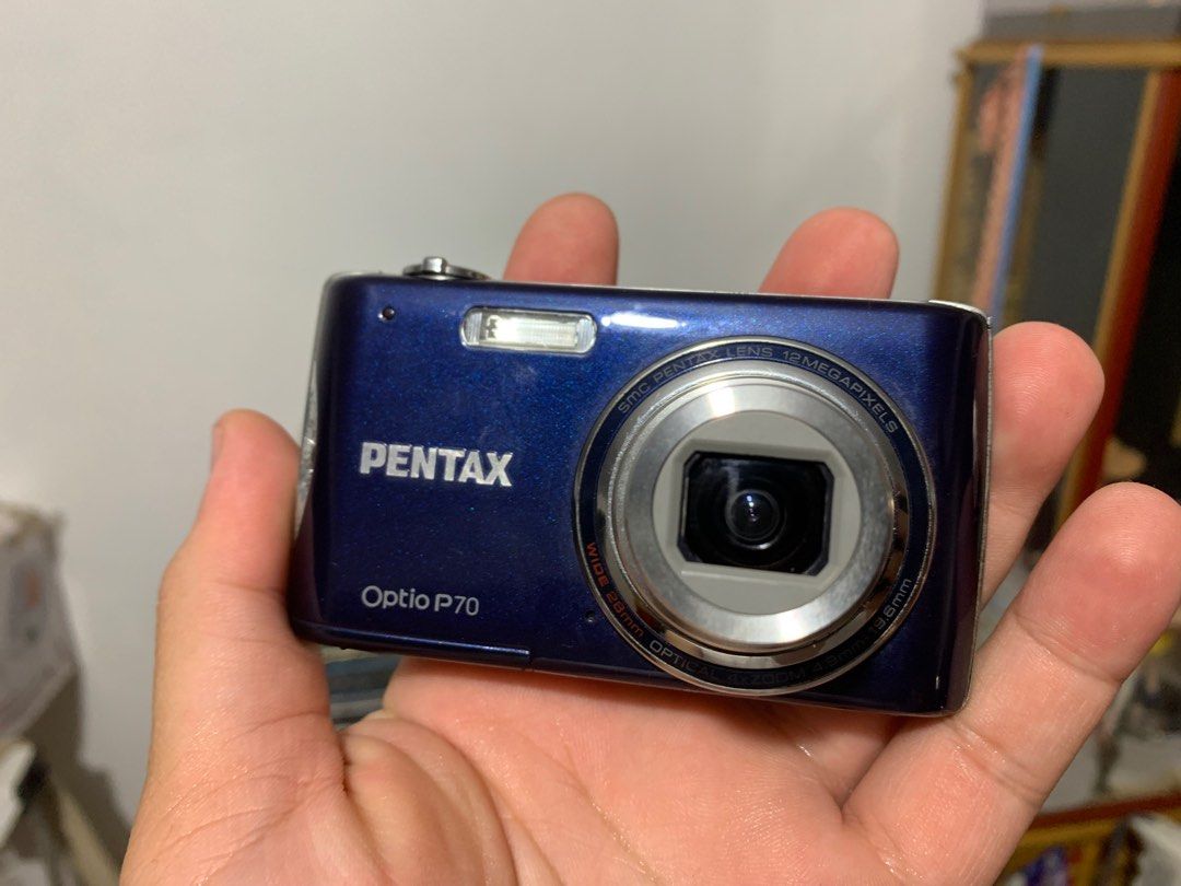 Pentax Optio P70 12MP Digital Camera (Category: Cameras) located in Manila. Submitted by miah_collectiblesurplus (Listing ID 1416577446, Image 1). Description: 3,990 pesos Location: Valenzuela Tested working from Japan item Wala charger working flash selling as is what you see is what you get .