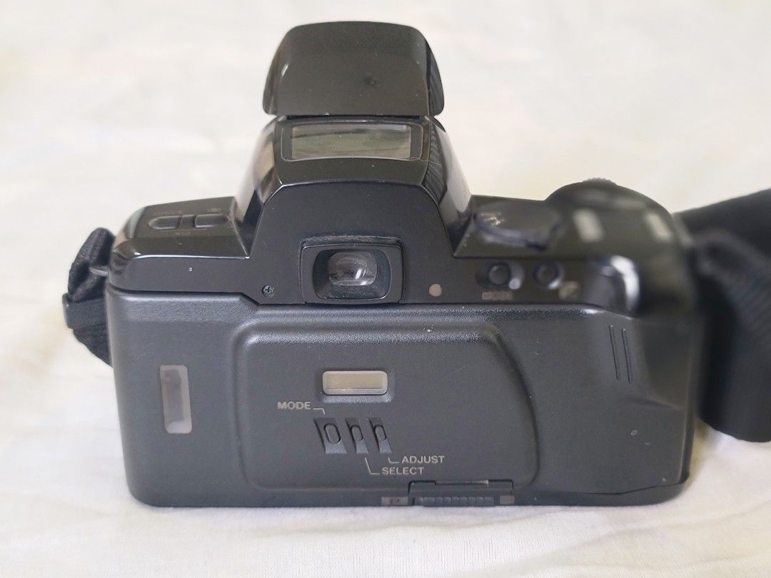 Pentax PZ-70 Camera with Strap (Category: Cameras) located in Manila. Submitted by gane_esla (Listing ID 1416501835, Image 2). Description: FOR COLLECTORS'S USE ONLY. NOT WORKING - Pentax PZ-70 camera - Includes lens cap and neck strap - Built-in flash - Black camera body - Features buttons and dials for settings.