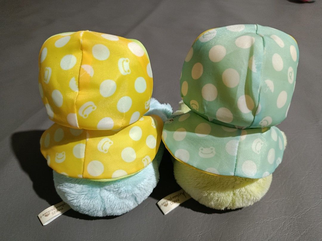 Pickles the Frog Paris Pluie Series (Category: Plushies & Soft Toys) located in Angeles City. Submitted by lnptoysandcollectibles (Listing ID 1416512197, Image 2). Description: - Cute Pickles the Frog plush toys - Features: - Polka-dot hood - Matching raincoat - Colors: Light blue and light green - Bib details: Button and "PARIS pluie pickles" print - Soft and cuddly material.