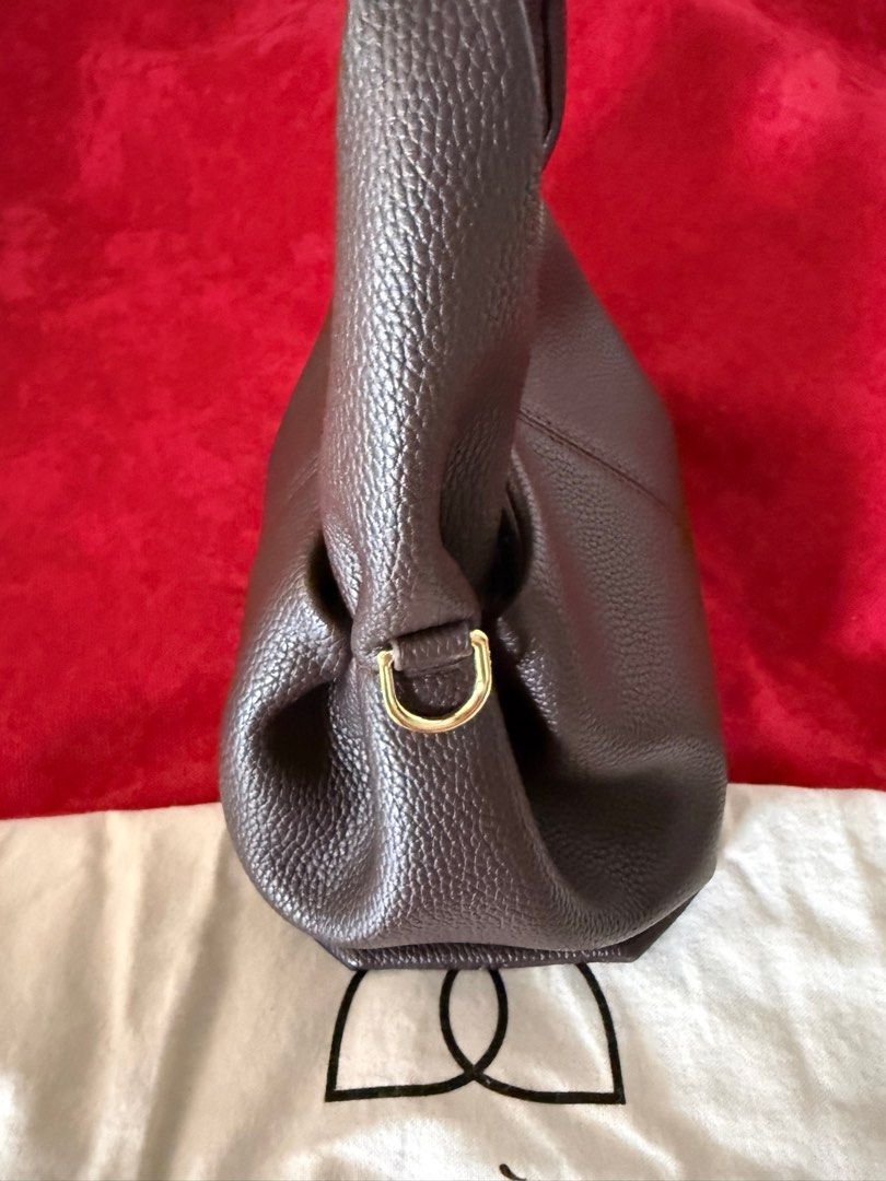 Polène Handbag (Category: Luxury Bags & Wallets) located in Quezon City. Submitted by kween_g (Listing ID 1416448274, Image 2). Description: - Brown Polène handbag - Top handle design - Elegant gold-colored hardware - Textured exterior finish - Includes dust bag - Polène logo visible -Long strap Selling for a friend. Need funds for tuition fee.