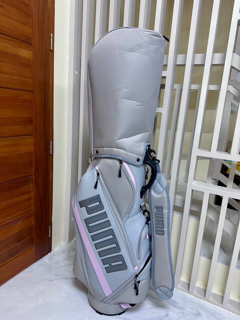 Puma Golf Bag (Category: Golf) located in Cavite. Submitted by johnlisting (Listing ID 1416469781, Image 2). Description: - Puma golf bag in a light grey and pink color scheme (Ladies color design) - Multiple compartments 5 slots) and pockets for organization. - Includes a shoulder strap for easy carrying. - Brand New, used only to transport golf club set, never been use at fairway and driving range.