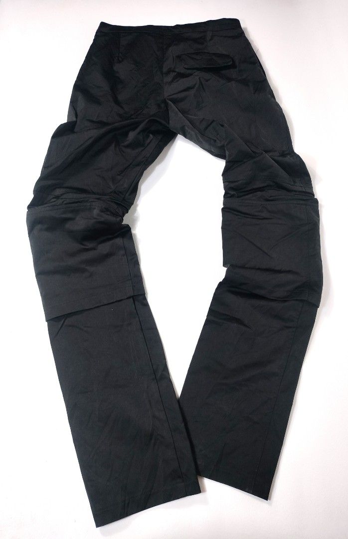 Raf Simons Archive Slim Space Pants with Pockets (Category: Jeans) located in Manila. Submitted by callmetin (Listing ID 1416564484, Image 2). Description: Black Raf Simons Slim Space Pants with pockets. Features a zip closure. The pants are labeled as model 182-327, size 48, and made in Italy. The material is 100% polyester. The pants have a unique design with extra fabric on the legs. Condition : Excellent Size : 45 Actual 👇 Waist : 30 Lenght 
