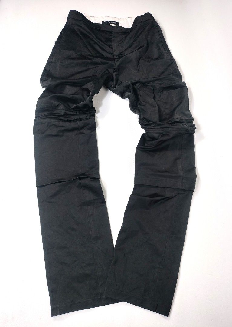 Raf Simons Archive Slim Space Pants with Pockets (Category: Jeans) located in Manila. Submitted by callmetin (Listing ID 1416564484, Image 1). Description: Black Raf Simons Slim Space Pants with pockets. Features a zip closure. The pants are labeled as model 182-327, size 48, and made in Italy. The material is 100% polyester. The pants have a unique design with extra fabric on the legs. Condition : Excellent Size : 45 Actual 👇 Waist : 30 Lenght 
