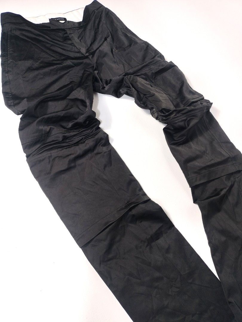 Raf Simons Archive Slim Space Pants with Pockets (Category: Jeans) located in Manila. Submitted by callmetin (Listing ID 1416564484, Image 3). Description: Black Raf Simons Slim Space Pants with pockets. Features a zip closure. The pants are labeled as model 182-327, size 48, and made in Italy. The material is 100% polyester. The pants have a unique design with extra fabric on the legs. Condition : Excellent Size : 45 Actual 👇 Waist : 30 Lenght 