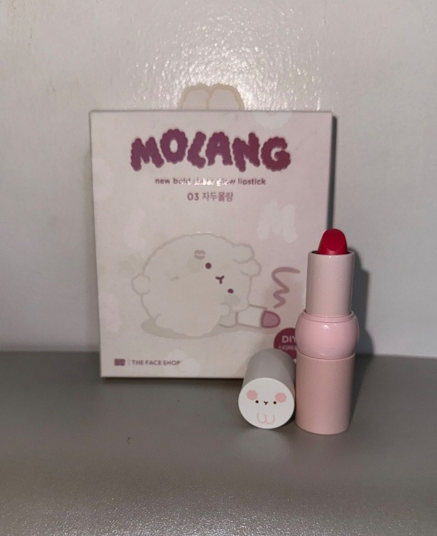 The Face Shop Molang Lipstick (Category: Makeup) located in Quezon City. Submitted by _mt_1234 (Listing ID 1416570003, Image 2). Description: - The Face Shop Molang Sheer Glow Lipstick (3.5g) - Shade: 03 Jadu Molang - Color: Vibrant red - With free stickers .