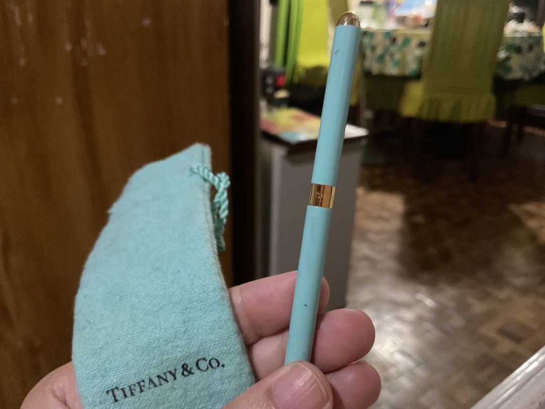 Tiffany & Co. Pen (Category: Luxury Accessories) located in San Pedro. Submitted by whatandeverdelights (Listing ID 1416452750, Image 1). Description: - Tiffany & Co. pen - Light blue color - Gold-colored accents - Includes matching pouch - Perfect for gifts or everyday use - All sales final.