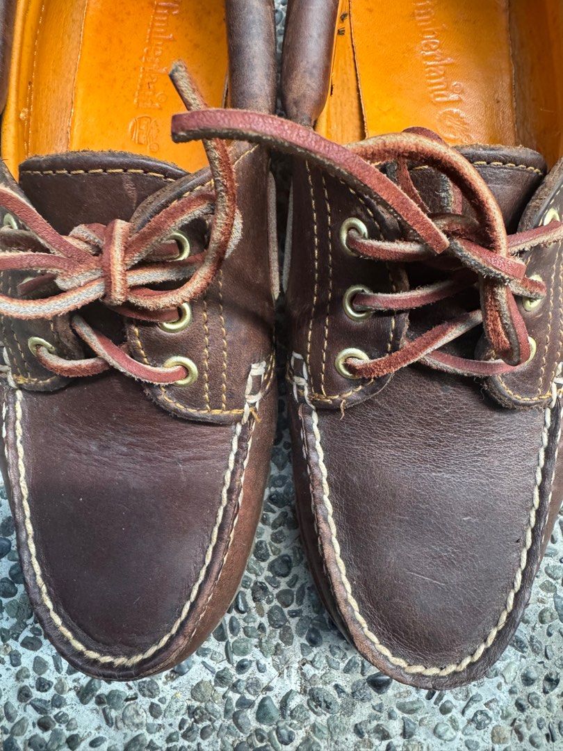 Timberland Boat Shoes - Brown (Category: Loafers) located in Paranaque City. Submitted by heritagemnl (Listing ID 1416457631, Image 1). Description: - Timberland boat shoes - Brown leather - Leather upper - Lace-up closure - Orange lining - Rubber sole with Timberland logo - Signs of wear on leather and soles.