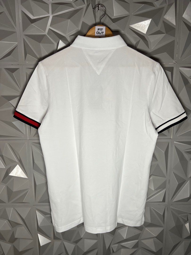 Tommy Hilfiger White Polo Shirt (Category: Tshirts & Polo Shirts ) located in Taguig. Submitted by julzfausti03386 (Listing ID 1416444697, Image 2). Description: - Tommy Hilfiger polo shirt 📏 Available Sizes: • Medium – 21 x 26 • Large – 22 x 27 • XL – 23 x 28 - Short sleeves - Features Tommy Hilfiger logo - Signature colors on cuffs - Brand new with original tags - Made in Vietnam.