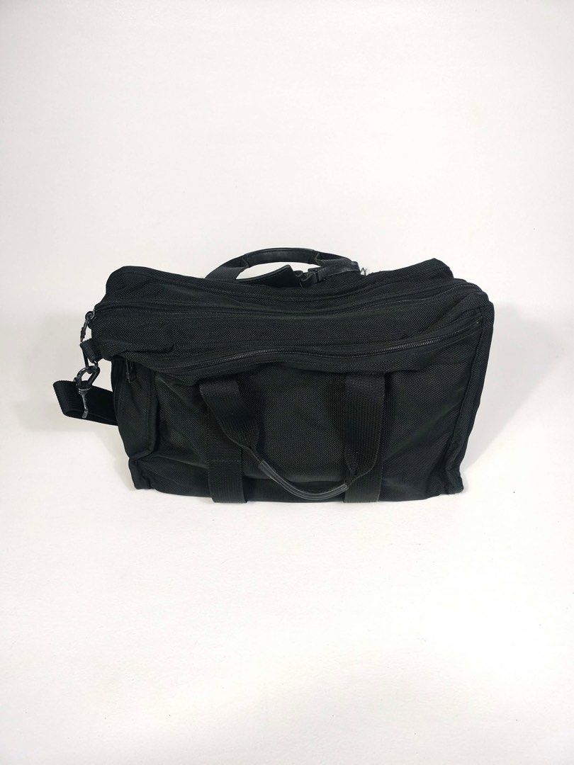 Tumi Black Briefcase (Category: Briefcases) located in Manila. Submitted by naphthrift (Listing ID 1416637284, Image 2). Description: Check out this classic Tumi black briefcase! It's got that signature Tumi durability and style, perfect for everyday use or travel. You can see it's been well-loved, but still has plenty of life left. It has multiple compartments to keep your things organized. The black color is super versatile and goes with everyt