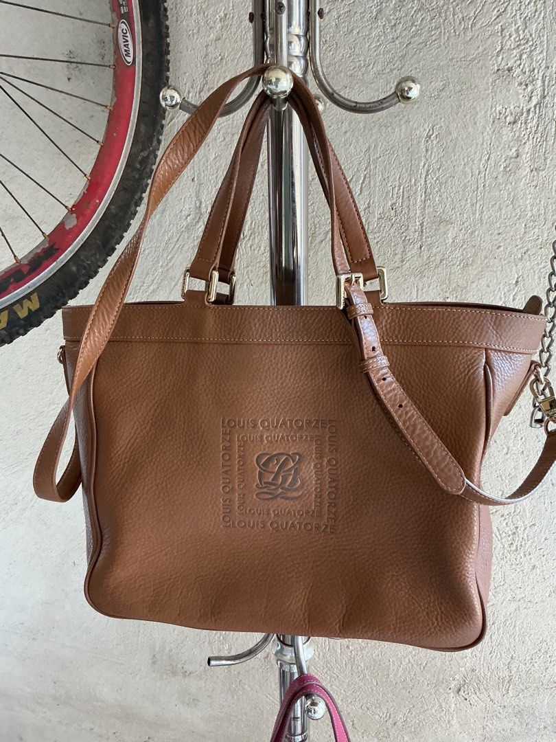 Two-way bag with 3 compartments and pockets inside (Category: Cross-body Bags) located in Santa Maria. Submitted by marvi_declutter (Listing ID 1416600266, Image 3). Description: As sign of used the 4corners on the base of the bag have rubs, but unnotice once using.