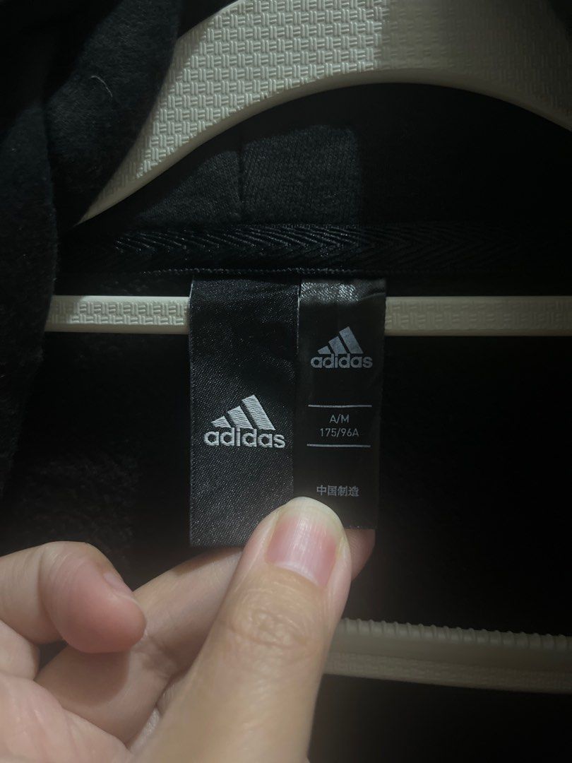 Adidas Hoodie with Stripes (Category: Hoodies) located in Valenzuela. Submitted by gengen13 (Listing ID 1413182248, Image 3). Description: - Black Adidas hoodie - White stripes on sleeves - Adidas logo on chest - Size: A/M 175/96A - Hood and front pocket - Minor mark on sleeve - Tagline: "I am sport. Gameday or any day." Dimes : L 24.5 W 21.5 With marks sa sleeve. Labhan nio nlng po. Color rating 9/10 With signs of usage Preloved item. Pls manage