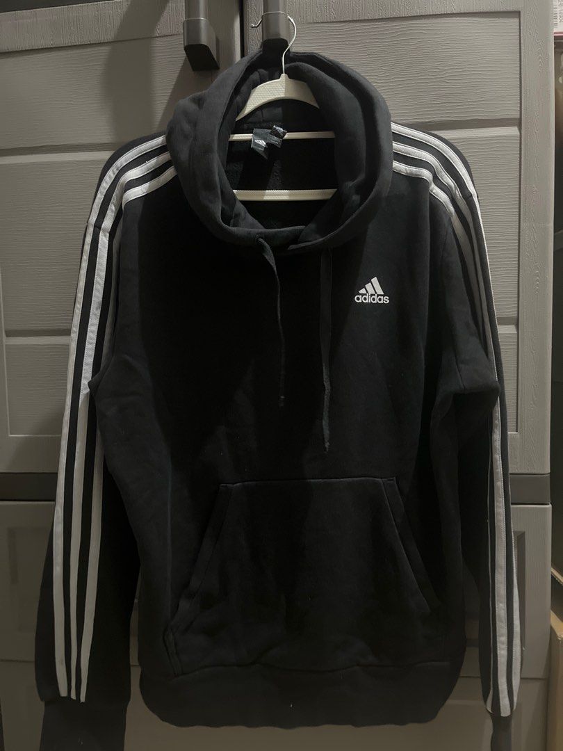 Adidas Hoodie with Stripes (Category: Hoodies) located in Valenzuela. Submitted by gengen13 (Listing ID 1413182248, Image 1). Description: - Black Adidas hoodie - White stripes on sleeves - Adidas logo on chest - Size: A/M 175/96A - Hood and front pocket - Minor mark on sleeve - Tagline: "I am sport. Gameday or any day." Dimes : L 24.5 W 21.5 With marks sa sleeve. Labhan nio nlng po. Color rating 9/10 With signs of usage Preloved item. Pls manage