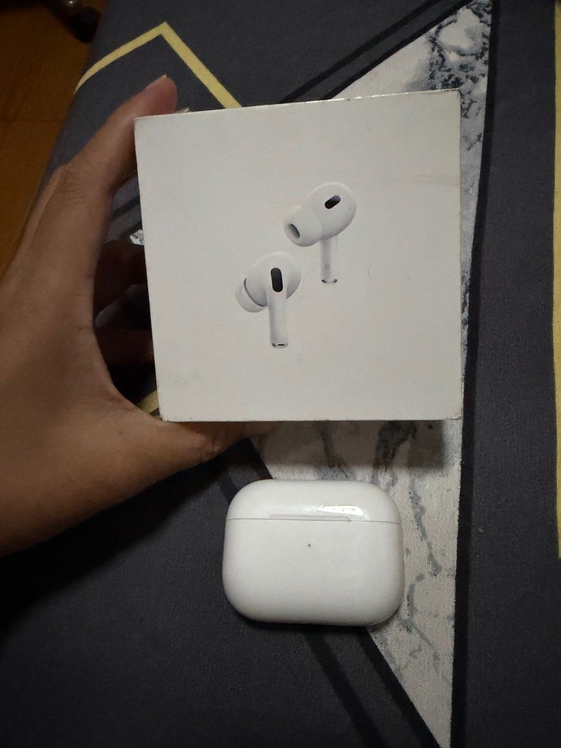 Apple AirPods Pro 2nd Gen (Category: Earphones) located in Manila. Submitted by prettyrae (Listing ID 1413130704, Image 1). Description: - Apple AirPods Pro 2nd Gen - Includes MagSafe charging case - Comes with earphones and charging case - Charging case features a light indicator - Color: White - Original price: ₱15,990.