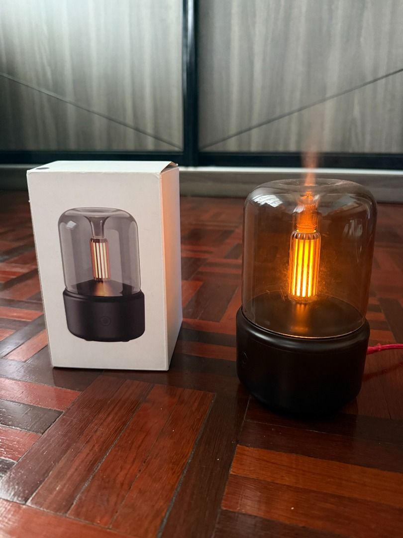 Aromatherapy Diffuser Candlelight (Category: Home Fragrance) located in Kuching. Submitted by teampajamas (Listing ID 1413106501, Image 1). Description: Letting go Aromatherapy Diffuser Candlelight for RM 25 inclusive of shipping Has visible water stains (internal only) but overall functions still intact Suitable for those who prefer gentle/candlelight design Reason to let go: No longer using - Stylish aroma diffuser - Glass cover and warm light 
