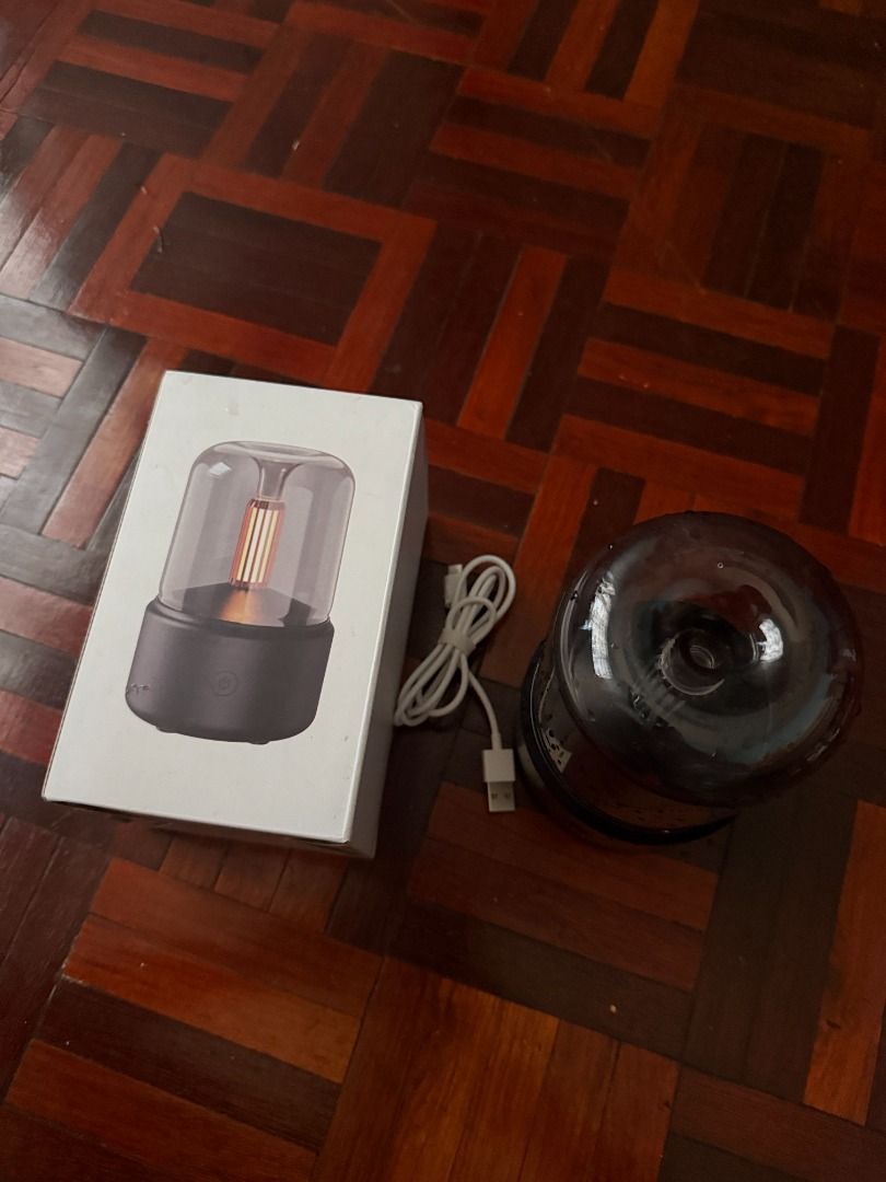 Aromatherapy Diffuser Candlelight (Category: Home Fragrance) located in Kuching. Submitted by teampajamas (Listing ID 1413106501, Image 3). Description: Letting go Aromatherapy Diffuser Candlelight for RM 25 inclusive of shipping Has visible water stains (internal only) but overall functions still intact Suitable for those who prefer gentle/candlelight design Reason to let go: No longer using - Stylish aroma diffuser - Glass cover and warm light 