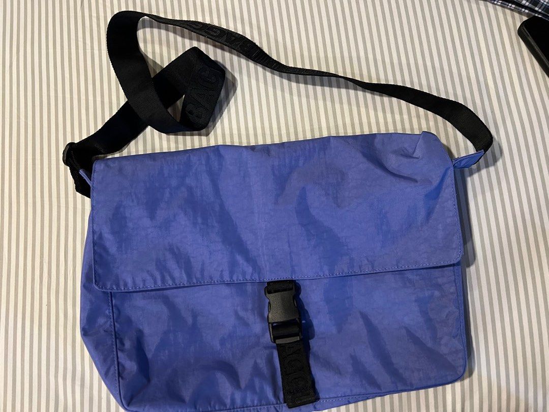 Baggu Nylon Messenger Bag in Blue (Category: Sling Bags) located in Manila. Submitted by coclosets (Listing ID 1413101163, Image 2). Description: - No tag but brand new and never used - Selling below SRP - Two large exterior pockets in addition to the main interior compartment. - Has an interior laptop sleeve with velcro closure that fits 13/14” laptop in a puffy case. - Bag Dimensions: 10 in. H x 14.5 in. W x 4.5 in. D - Exterior Front Slip Pock