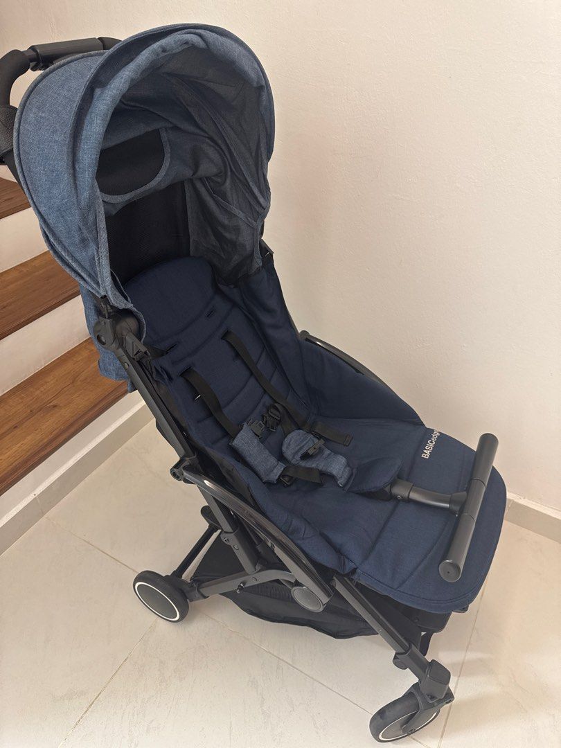 Basic Gadget Stroller (Category: Strollers) located in Kuala Lumpur. Submitted by ttee35 (Listing ID 1413110602, Image 3). Description: - Navy blue stroller - Compact and travel-friendly design - Includes sunshade - Features a safety harness - Easy-maneuvering handle - Lightweight - Branded.