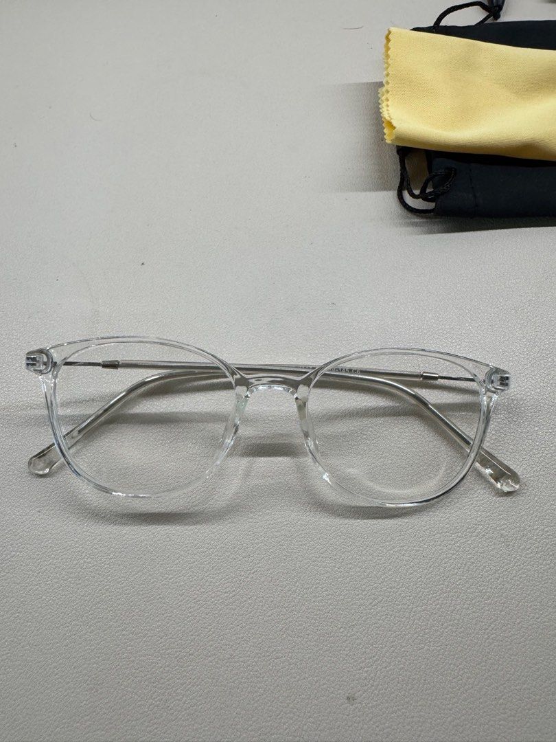 Blue Light Clear Frame Eyeglasses with Case (Category: Sunglasses & Eyewear) located in Muntinlupa City. Submitted by annalau19 (Listing ID 1413071022, Image 1). Description: - Clear frame eyeglasses - Includes black pouch and yellow cleaning cloth - Round shape - Plastic frame - Suitable for everyday use.