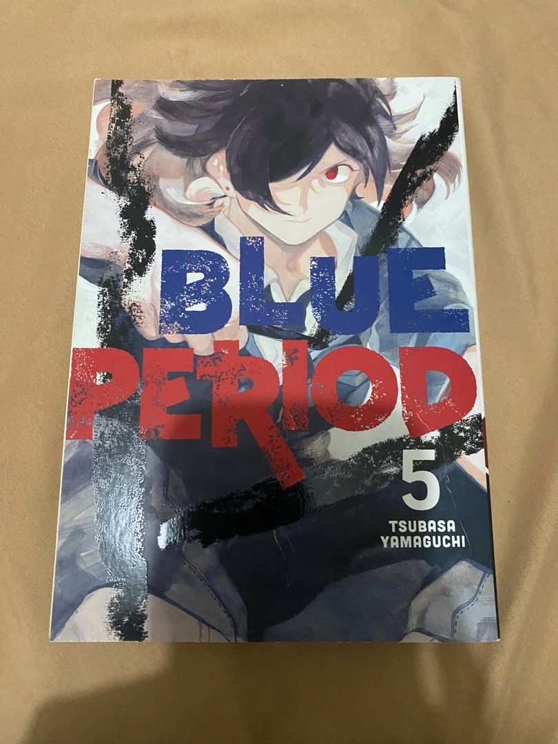 Blue Period Volume 5 (Category: Comics & Manga) located in Caloocan City. Submitted by krokak (Listing ID 1413144326, Image 1). Description: - Blue Period Volume 5 manga. - Features Yatora's struggles and growth at TUA. - Focuses on Yatora's efforts to improve. - Includes Yatora's self-portrait and interactions with Hashida. - Explores Yatora's journey to find his artistic path..