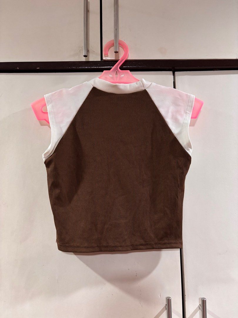 California West Coast Crop Top (Category: Others Tops) located in Manila. Submitted by baddxss (Listing ID 1413166981, Image 2). Description: Brown and white crop top with "CALIFORNIA WEST COAST" printed on the front. Features a ribbed texture on the brown fabric and white panels on the shoulders. Sleeveless design with a round neckline..