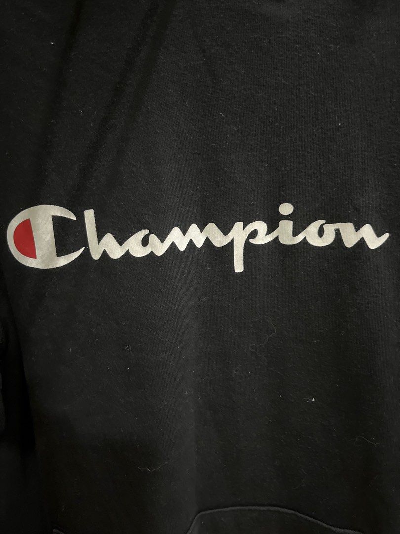 Champion Hoodie - Black - Large (Category: Hoodies) located in Valenzuela. Submitted by gengen13 (Listing ID 1413183127, Image 2). Description: - Black Champion hoodie - Size: Large - Made in USA - Champion logo on front and left sleeve - Hood with drawstrings - Kangaroo pocket Dimes L 27.5 W 21.5 - color rating 9.5/10 With signs of usage Pls manage ur expecation. Preloved item Pm for more details.
