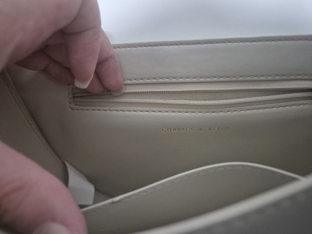 Charles & Keith Gabine Saddle Bag (Oat) (Category: Luxury Bags & Wallets) located in Cainta. Submitted by jamdgu (Listing ID 1413137981, Image 2). Description: Charles & Keith Gabine Saddle Bag in Oat Bought from Singapore Rarely used In excellent condition, with pouch MOP: Maya, GCash, BPI, UnionBank, GoTyme Delivery: J&T, Lalamove Loc: Cainta.