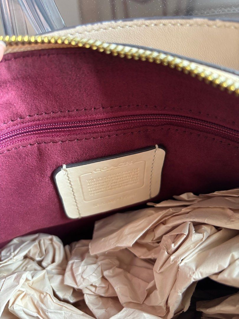 Coach Shay Shoulder Bag (Category: Luxury Bags & Wallets) located in Las Pinas. Submitted by itskat.cruz (Listing ID 1413072538, Image 3). Description: - Authentic Coach Shay shoulder bag - Signature canvas in monogram pattern - Top handle and detachable strap - Burgundy fabric lining - Includes dust bag.