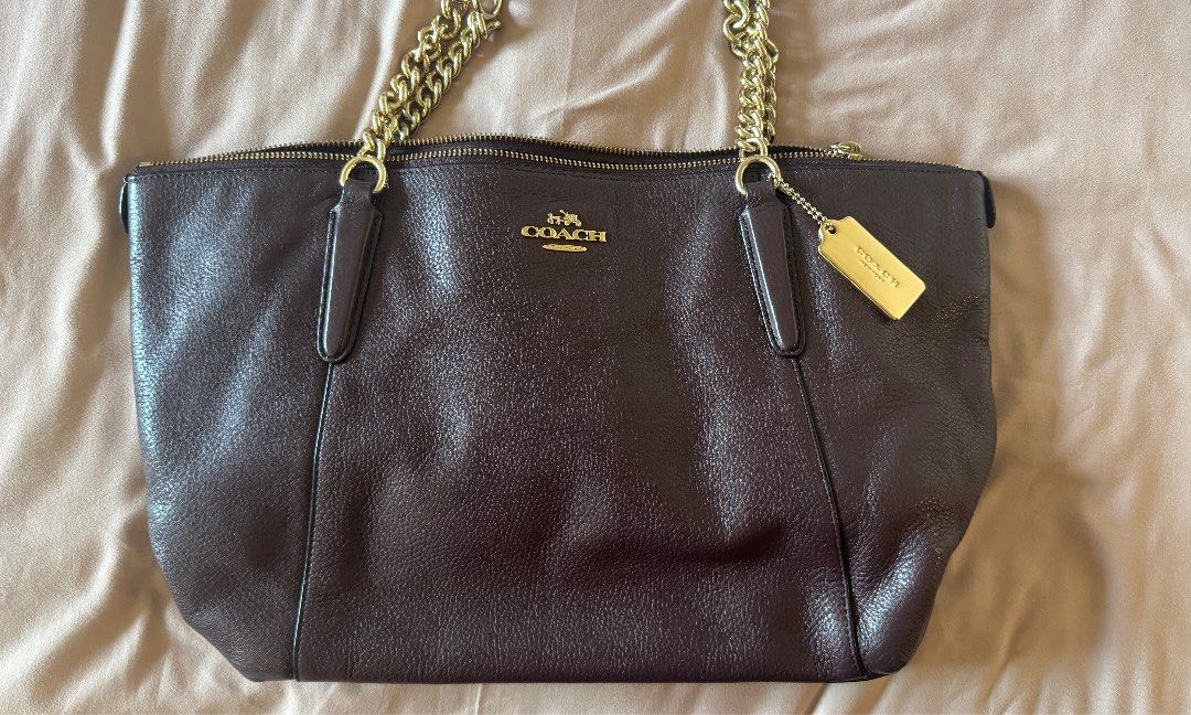 Coach Ava Chain Tote Bag - Brown Leather (Category: Luxury Bags & Wallets) located in Pasig City. Submitted by angosays (Listing ID 1413039903, Image 1). Description: Authentic, bought in the US Used once or twice SRP $379 Made from leather with gold-plated hardware, this large tote features a zip and turn lock closure, black shoulder strap handle, and a classic hobo bag style..