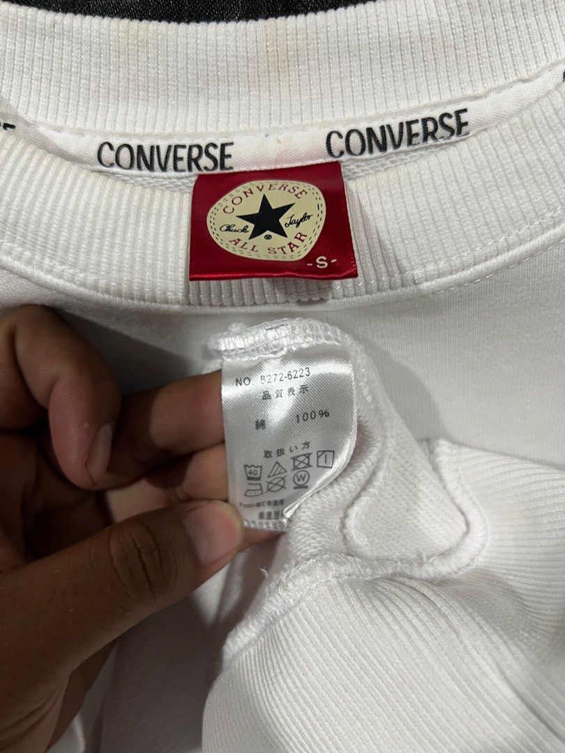 Converse Sweatshirt with Shoe Design - Size S (Category: Coats, Jackets and Outerwear) located in Manila. Submitted by naze0729 (Listing ID 1413165125, Image 3). Description: - 26 L 19 W - White Converse sweatshirt - Features a red shoe design on the front - Size: S - Crew neck - Long sleeves - Made of 100% material - Converse logo on collar - Plain white back.