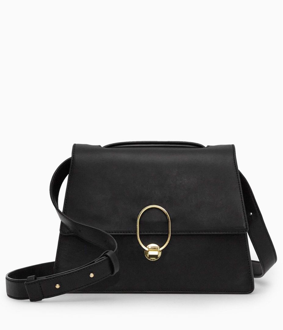 COS Black Leather Shoulder Bag (Category: Shoulder Bags) located in Manila. Submitted by _heya (Listing ID 1413215435, Image 1). Description: Brand new COS black leather shoulder bag! First two photos from the internet :) - Gold-tone metal ring closure - Detachable shoulder strap - Multiple interior compartments - Zippered pocket - Top handle - New with tags - Original price: $225/PHP13,000 - Stored in the closet so there’s minimal marks but leat