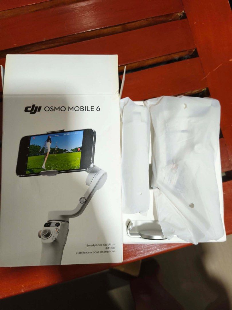 DJI Osmo Mobile 6 Smartphone Stabilizer (Category: Gimbals & Stabilizers ) located in Manila. Submitted by royalphoenix.b2a6e0 (Listing ID 1413101304, Image 2). Description: - DJI Osmo Mobile 6 smartphone stabilizer - White color - Includes original box - Comes with all original accessories - Designed for smooth, stabilized video recording.