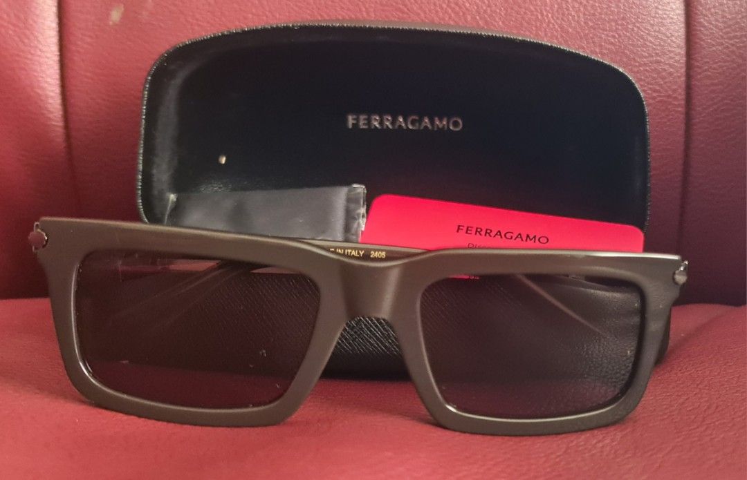 Ferragamo Sunglasses sf2015s (Category: Sunglasses & Eyewear) located in Las Pinas. Submitted by monjoy2011 (Listing ID 1413138002, Image 1). Description: - Authentic Ferragamo sunglasses - Includes original case, cleaning cloth, and authenticity card - Dark-colored, rectangular frame - Made in Italy - Model number visible on arm - Perfect for everyday wear -Gifted to me from us.