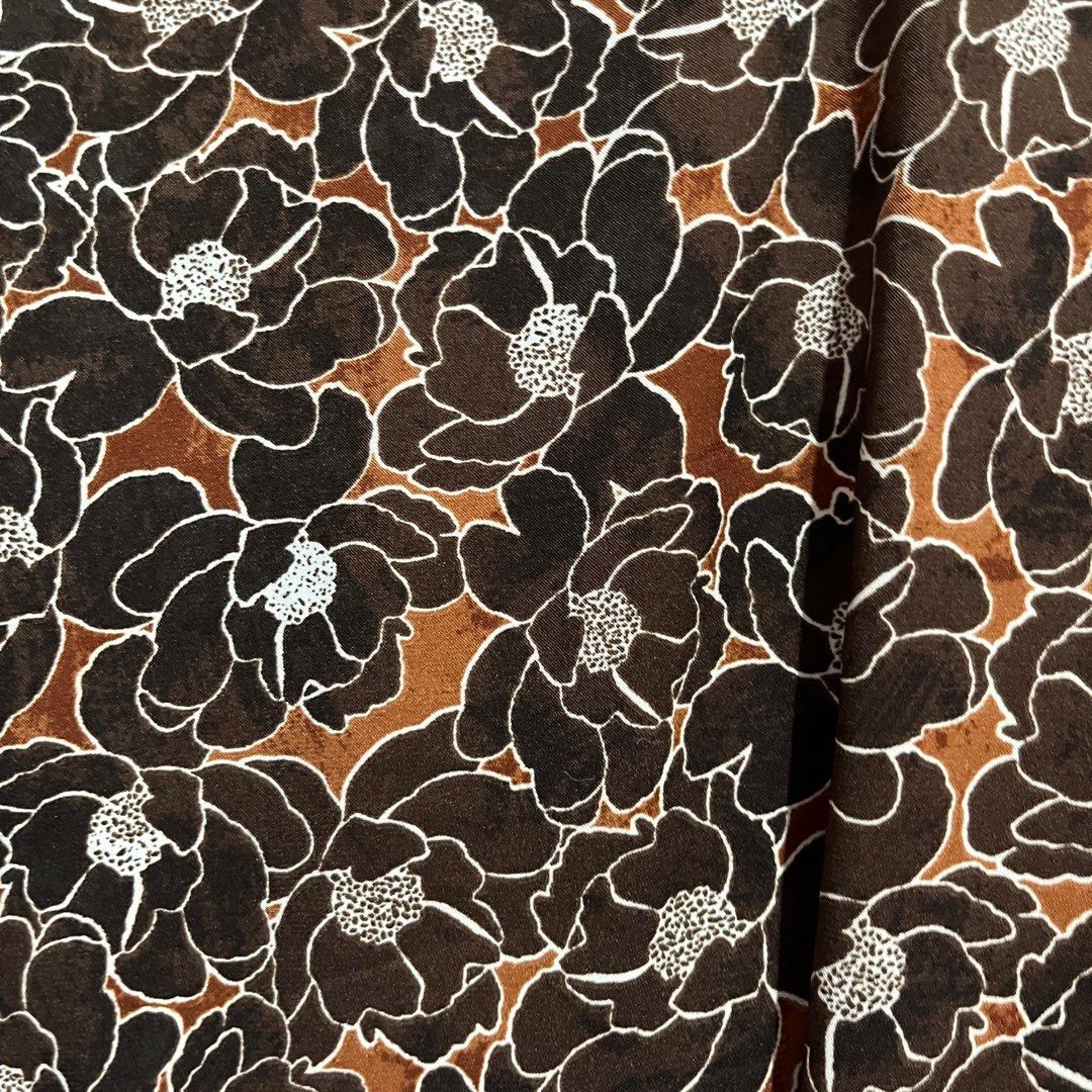 Floral Print Camisole Top (Category: Sleeveless) located in Pasig City. Submitted by ajdlsrysx (Listing ID 1413197614, Image 3). Description: - Floral print camisole - Colors: Brown, white, orange - Features: V-neck, spaghetti straps - Lightweight and breathable fabric - Perfect for warm weather - Versatile for various outfits.