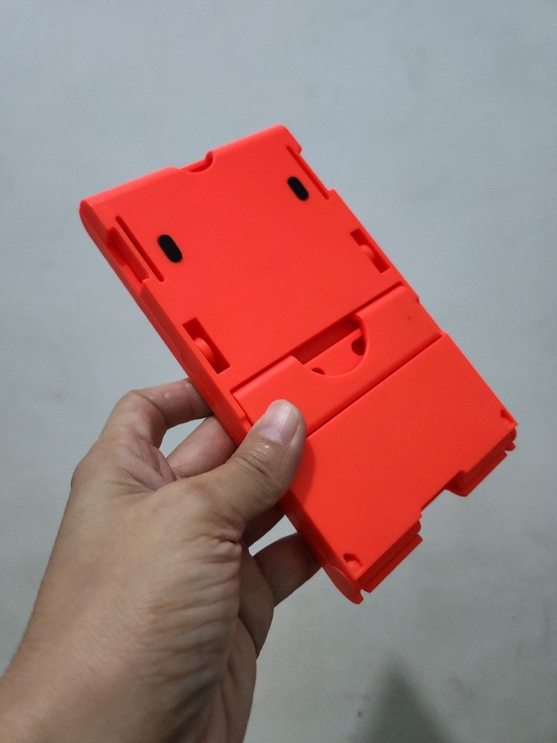 Foldable nintendo switch stand (Category: Nintendo) located in Quezon City. Submitted by prelovedisle.ph (Listing ID 1413222614, Image 2). Description: Preloved foldable switch stand. Pwede din sa tablet. No issues. Wysiwyg. #switchstand #foldableswitchstand #tabletstand .