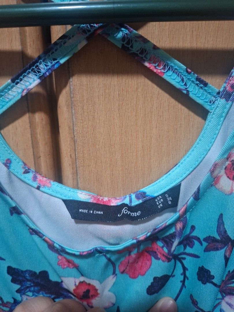 Forme Floral Summer Dress (Category: Blouses) located in Mandaluyong City. Submitted by ellydrea (Listing ID 1413140062, Image 2). Description: Forme floral top. Blue, pink, and white print. Criss-cross back. Sleeveless. Summer dress.