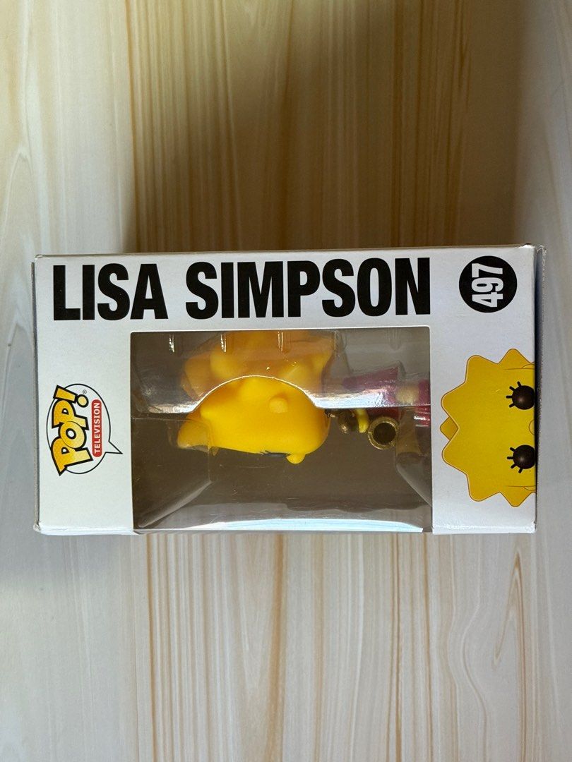 Funko Pop! Television: The Simpsons - Lisa Simpson #497 (Category: Designer & Blind Box Toys) located in Bacoor. Submitted by nixxpreloved (Listing ID 1413089057, Image 2). Description: - Funko Pop! figure of Lisa Simpson from The Simpsons. - Part of the Pop! Television series, #497. - Figure is in its original packaging. - Box features Lisa with her saxophone. - Back of the box displays other Simpsons characters..