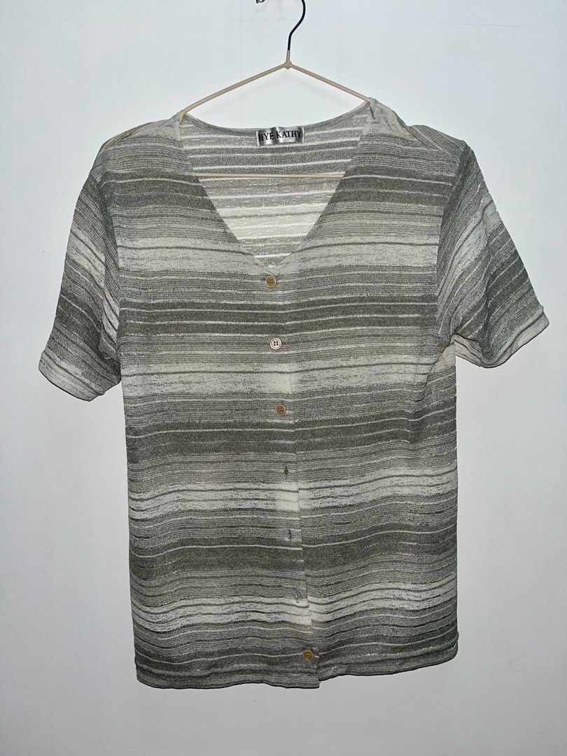 HYE KATHY Striped Button-Up Top (Category: Blouses) located in Las Pinas. Submitted by leimooonade (Listing ID 1413145137, Image 1). Description: - Brand: BYE KATHY - Style: Striped top - Neckline: V-neck - Sleeves: Short sleeves - Closure: Button-up front - Colors: Gray and white stripes - Fabric: Textured Size: L GCash only ‼️.