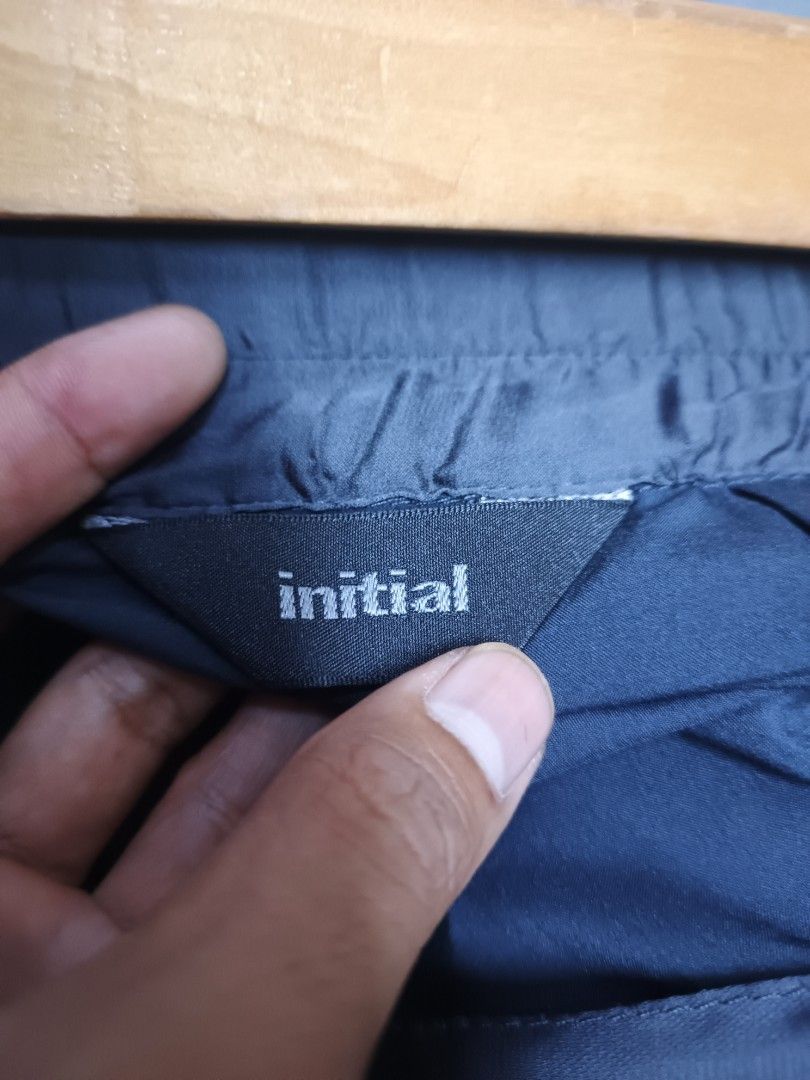 Initial Pleated Midi Skirt (Category: Skirts) located in Dasmarinas. Submitted by jessputrages (Listing ID 1413135503, Image 3). Description: - Initial midi skirt - Pleated design - Includes matching belt with buckle - Dark, possibly navy, fabric - 100% polyester - Comfortable elastic waistband - Perfect for a sophisticated look.