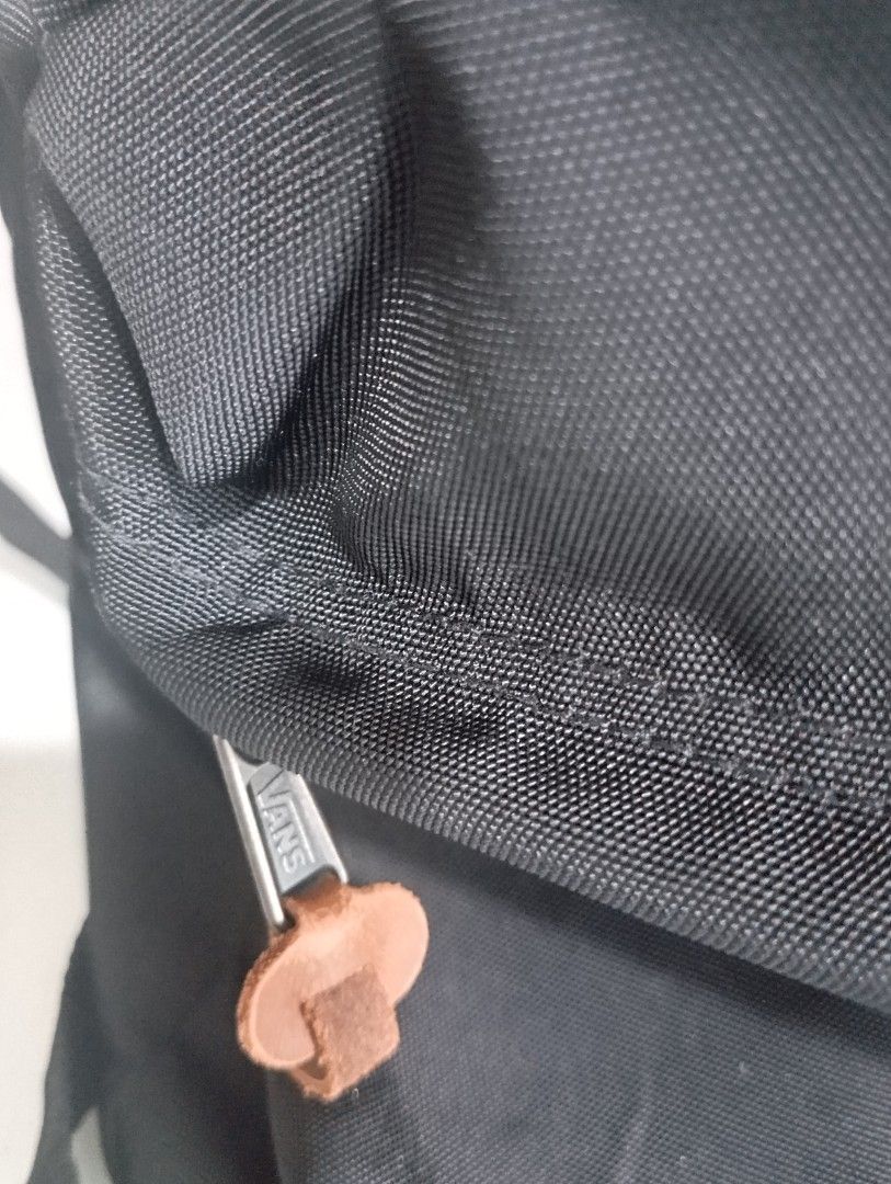 [LIKE NEW] Vans Backpack Black (Category: Backpacks) located in Pasig City. Submitted by chumingungg (Listing ID 1413107317, Image 2). Description: Black Vans backpack - Front pocket - Brown leather patch - Zipper closure with leather pull tab - Vans logo detail - Durable nylon material.