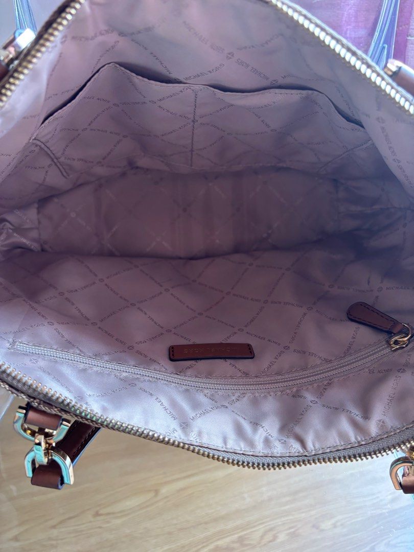 Michael Kors Bedford Large Tote Bag (Category: Luxury Bags & Wallets) located in Las Pinas. Submitted by itskat.cruz (Listing ID 1413074827, Image 3). Description: - Authentic Michael Kors Bedford Large tote bag (used once) - Brown and beige logo print coated canvas and leather - Brown leather accents - Secure zip closure - Interior lined with matching fabric - Multiple pockets inside - Comfortable double handles - Elegant gold-tone MK logo charm